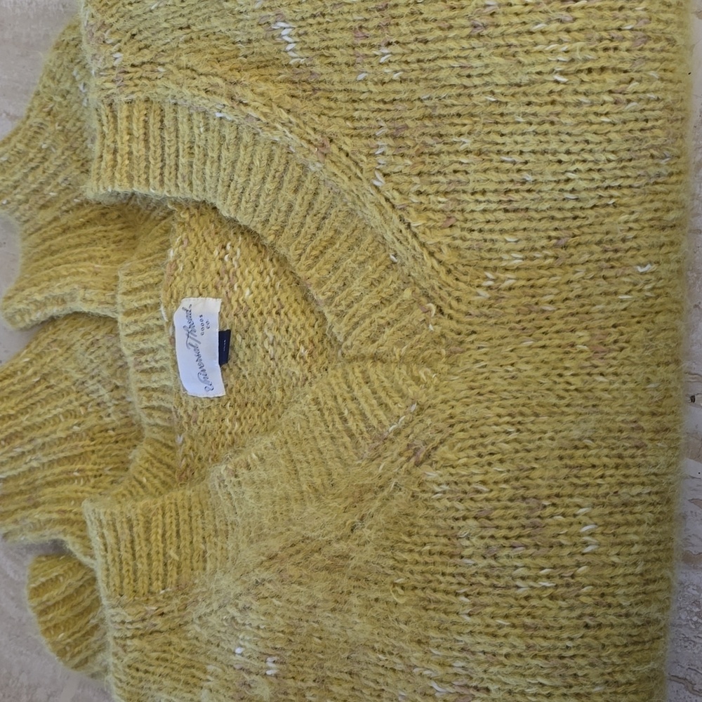 Soft and cozy...high/low sweater in a beautiful maize color.